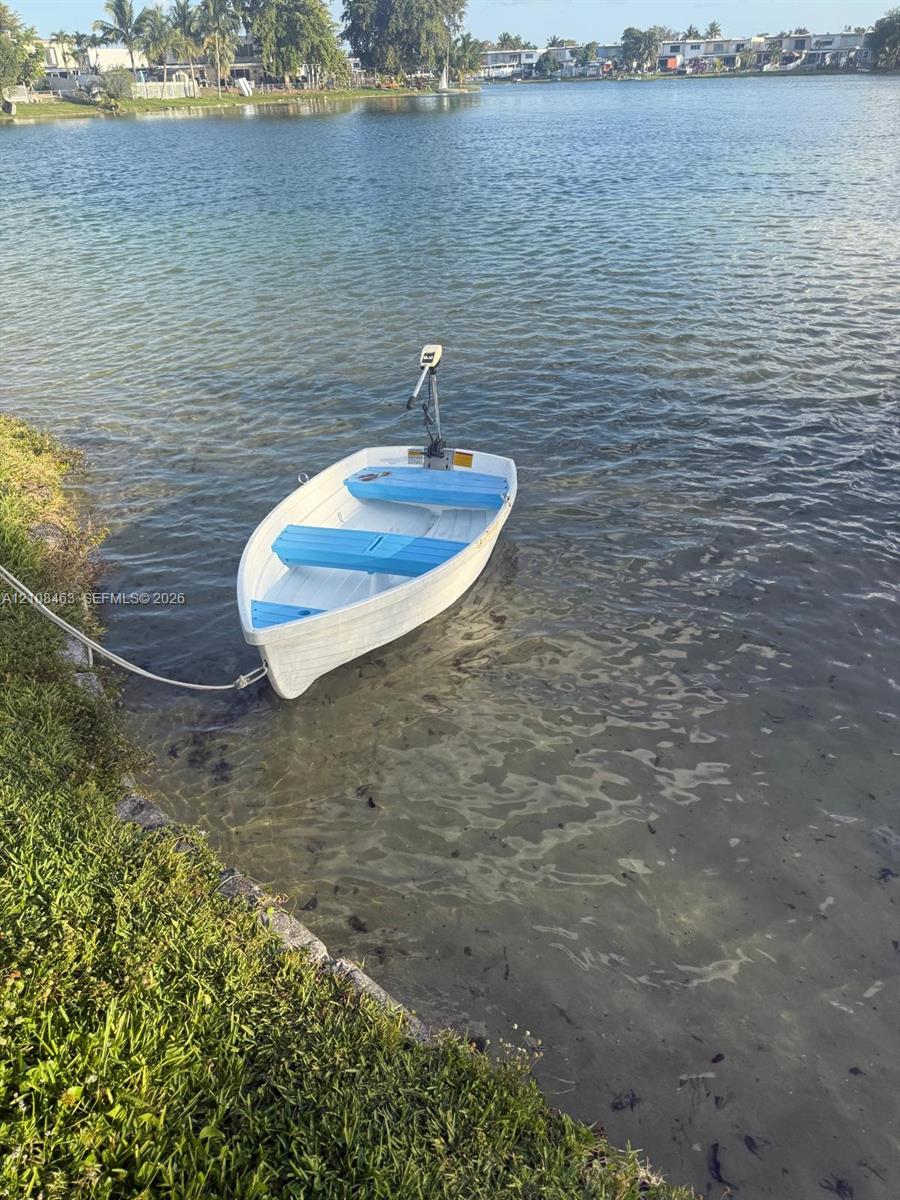 Waterfront property featuring a grass-lined shoreline and direct water access
