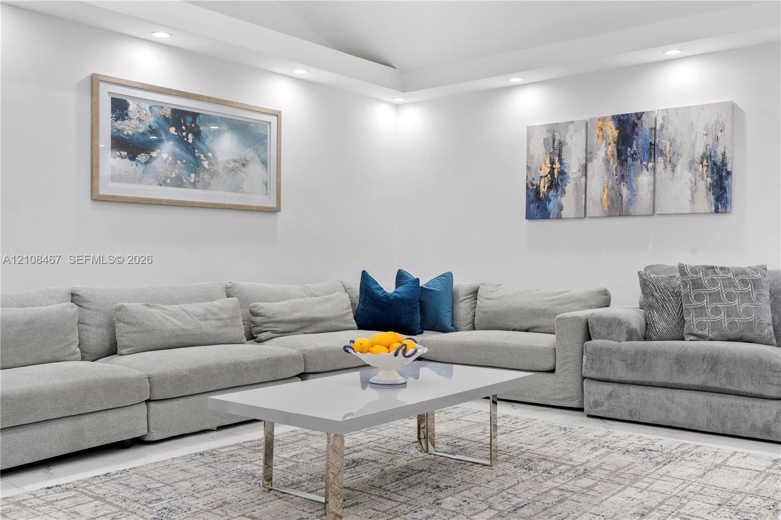 Interior space featuring recessed lighting and a tray ceiling