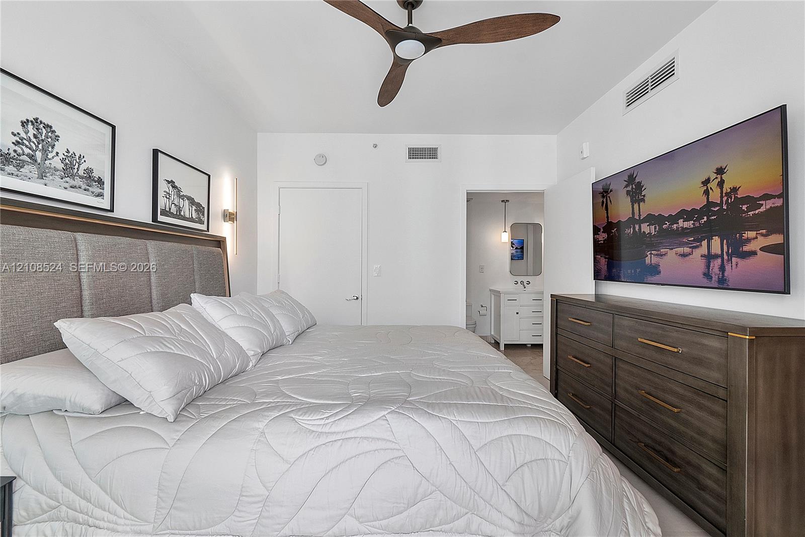 Three-blade ceiling fan, wall-mounted vertical light fixture, and recessed lighting Three-blade ceiling fan, wall-mounted vertical light fixture, and recessed lighting