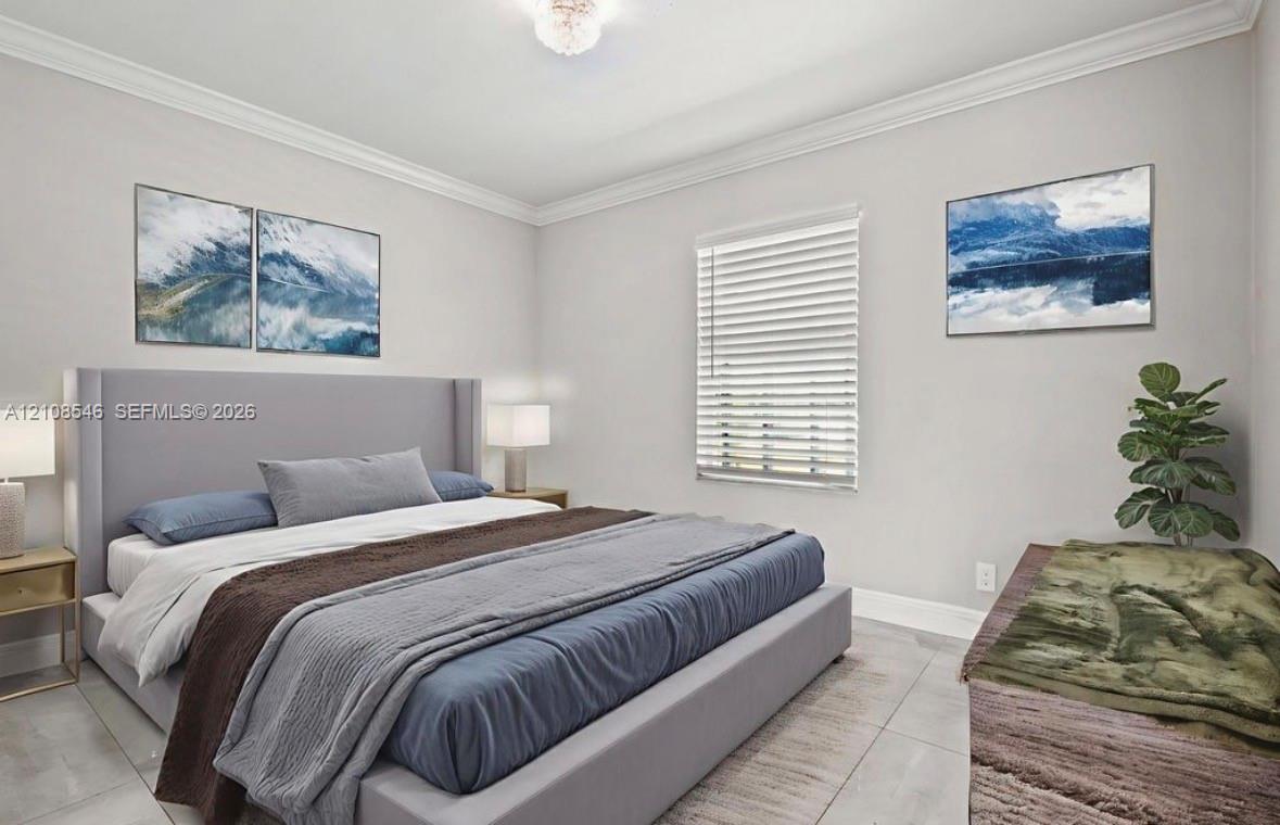 Neutral-toned interior featuring crown molding, ceramic tile flooring, and horizontal window blinds