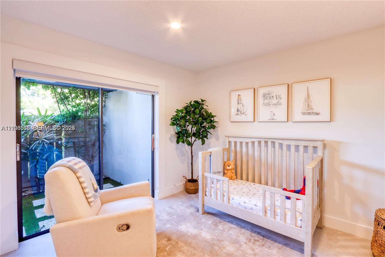 Sliding glass door with exterior access and recessed ceiling lighting