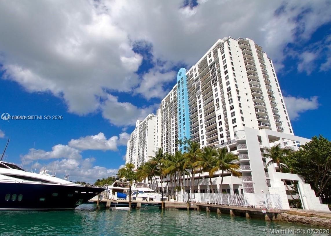 High-rise building exterior featuring private dockage, balconies, and extensive glass windows