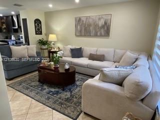 Neutral tone walls, large-format tile flooring, and recessed ceiling lighting Neutral tone walls, large-format tile flooring, and recessed ceiling lighting