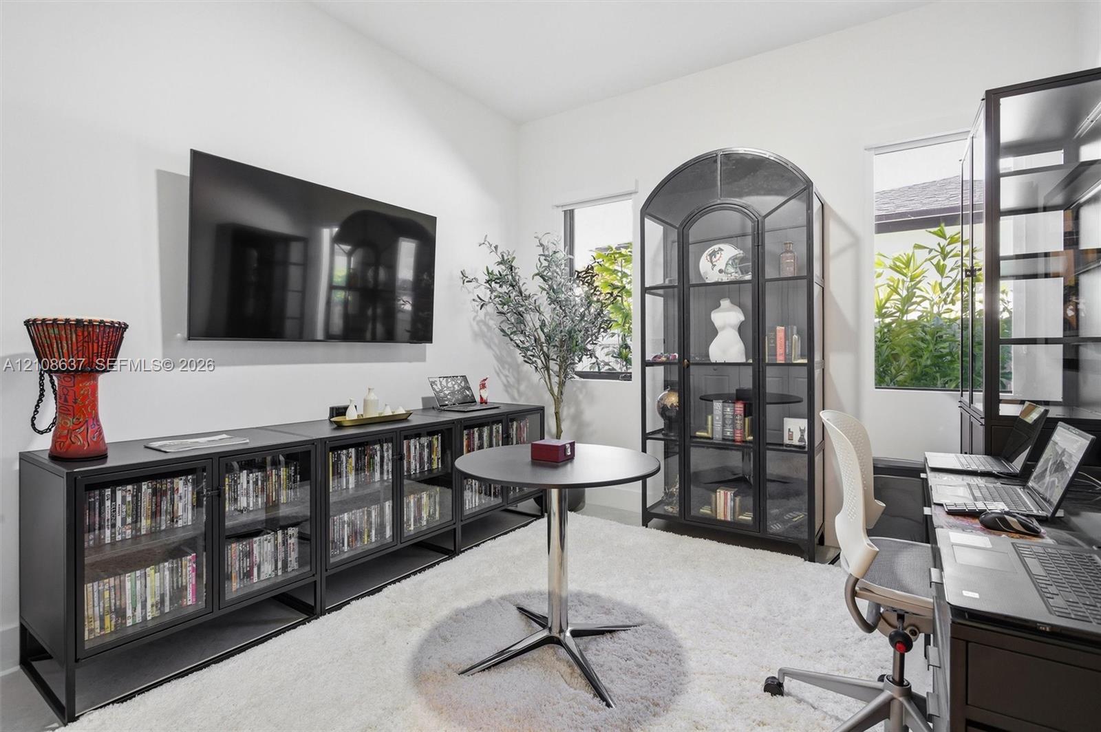 Neutral-toned interior featuring dual windows and light-toned flooring
