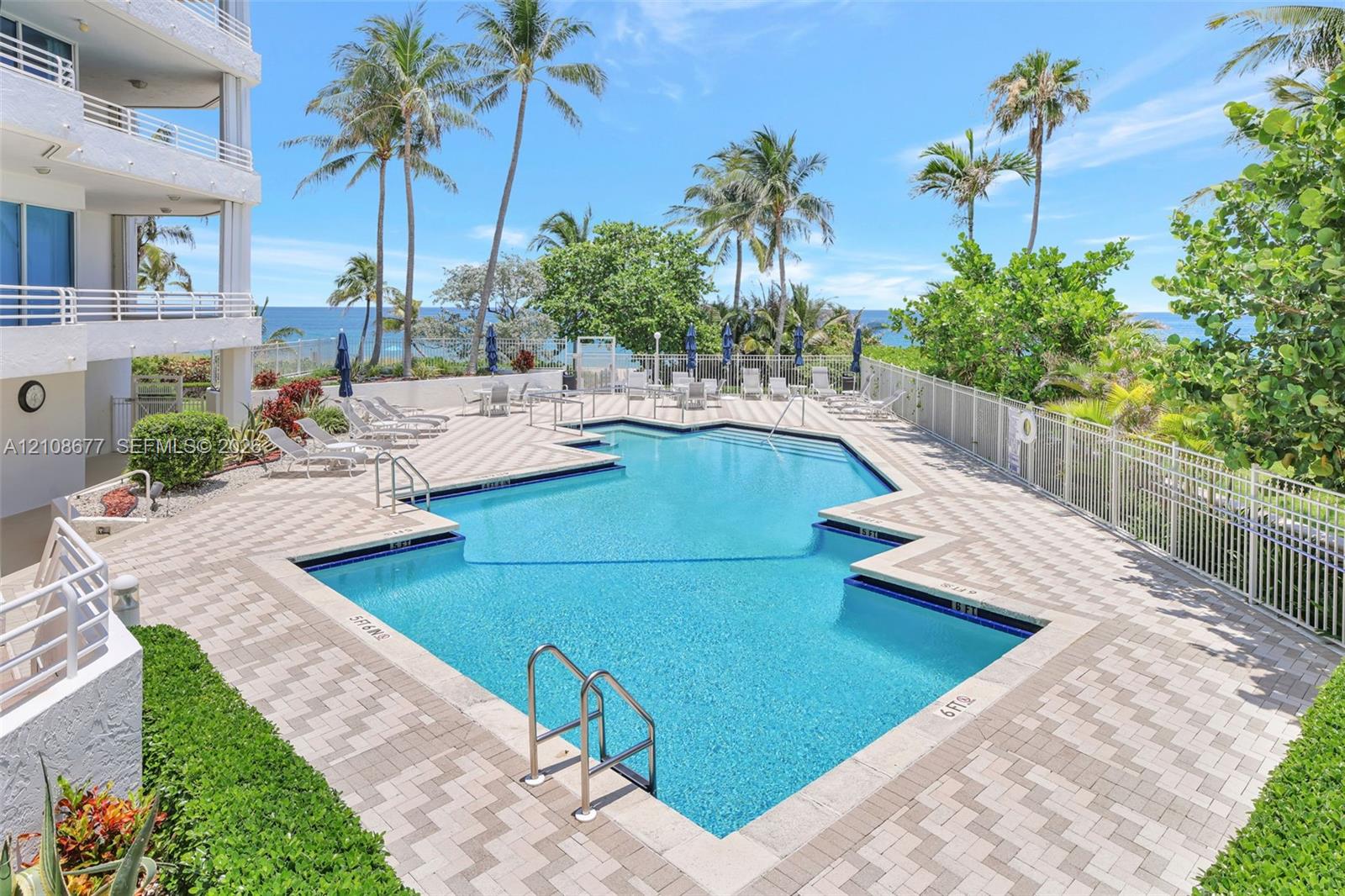 Swimming pool w/ tropical landscaping