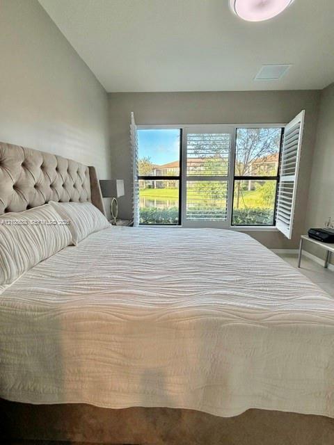 Triple-pane window configuration featuring white plantation shutters and natural lighting