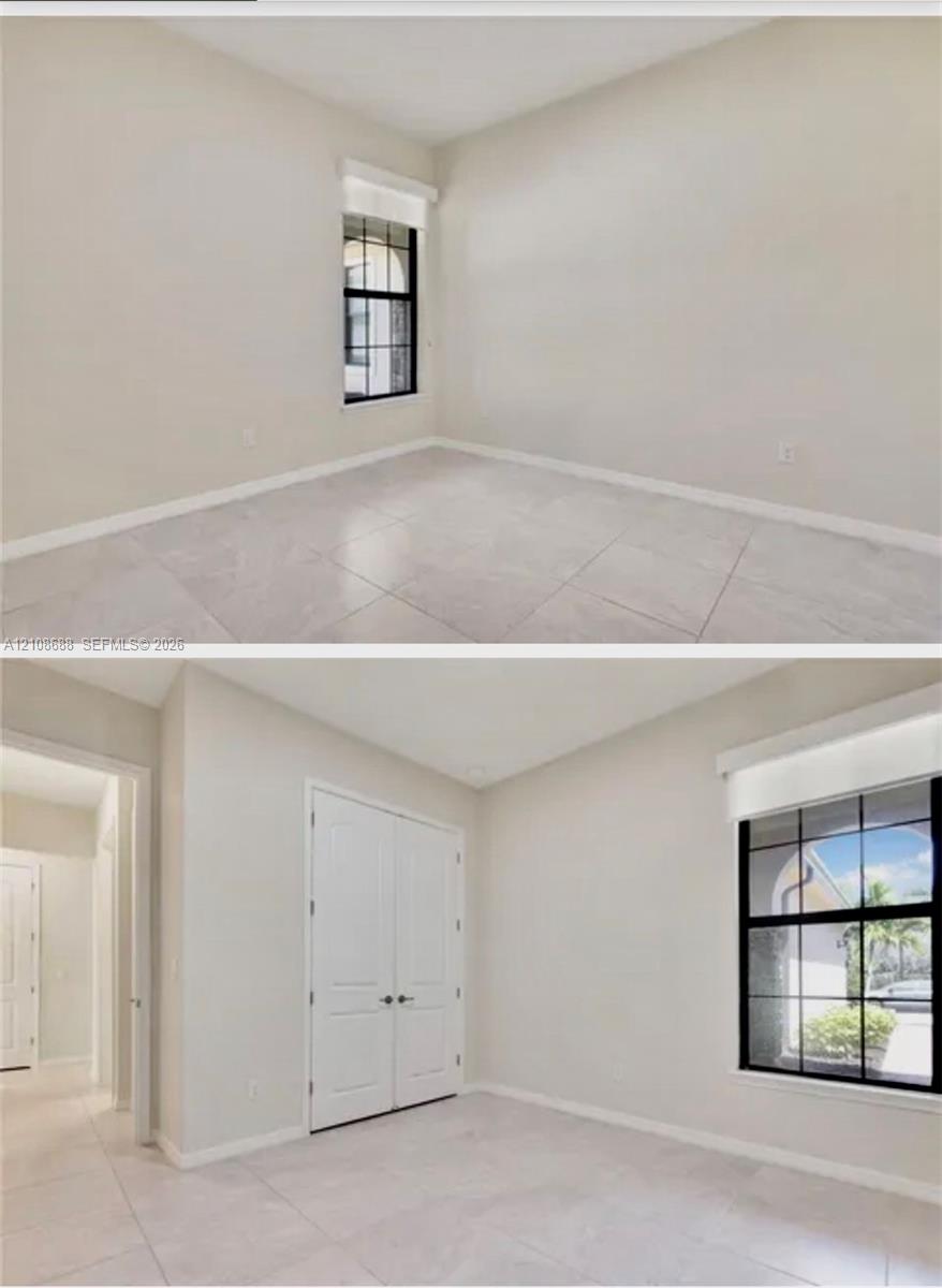 Neutral-toned ceramic tile flooring, dual-panel closet doors, and a window with a black muntin grid pattern