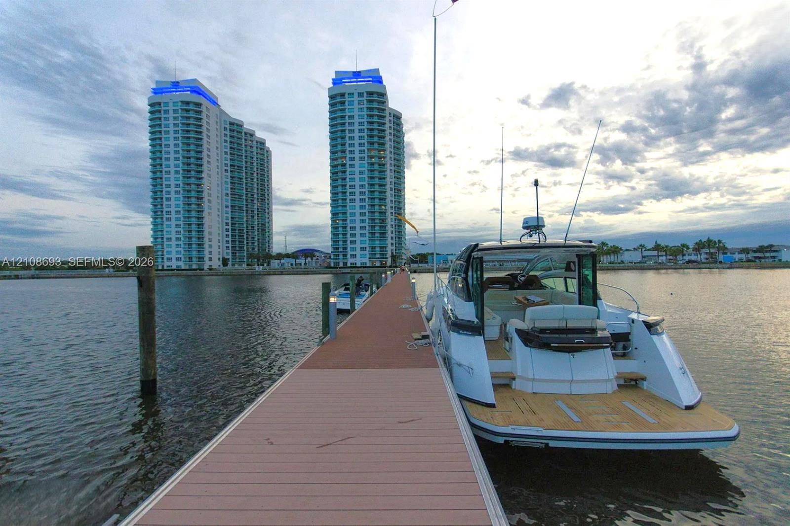 Fixed boat slip featuring composite decking, integrated dock lighting, and mooring pilings