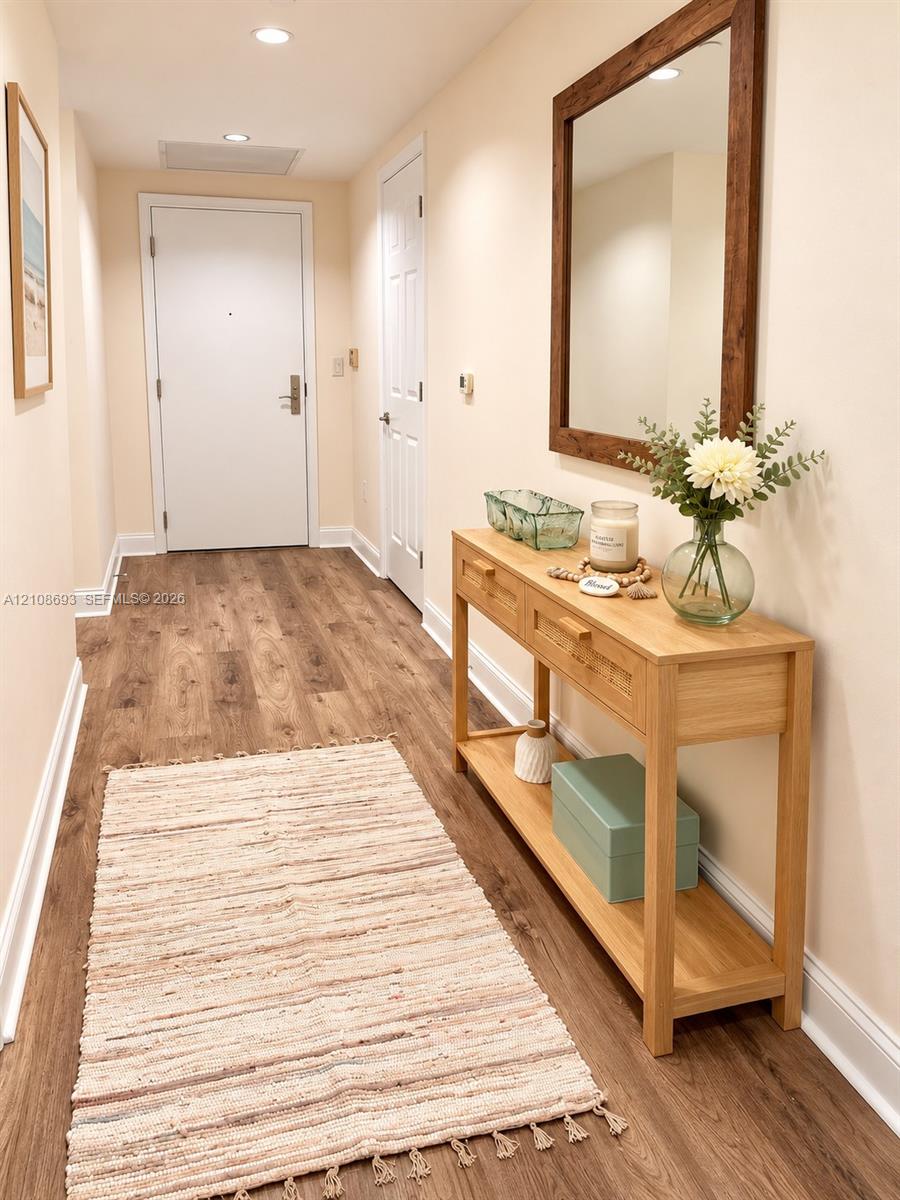 Wood-finish flooring, recessed lighting, and solid-core interior doors