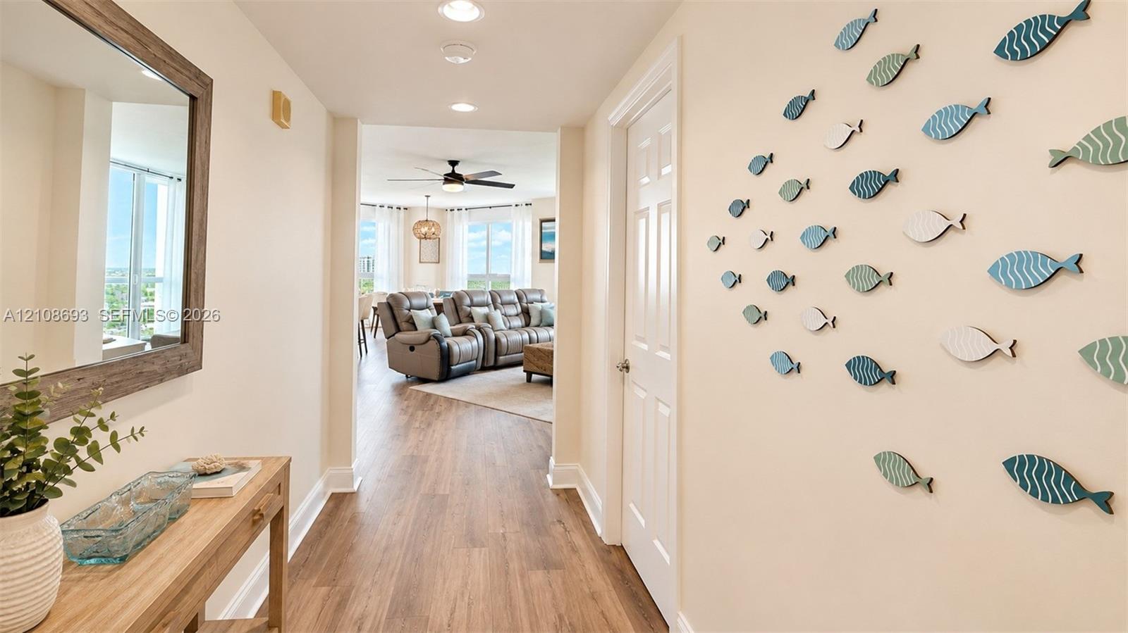 Entryway featuring wood-finish flooring, recessed lighting, and a six-panel interior door