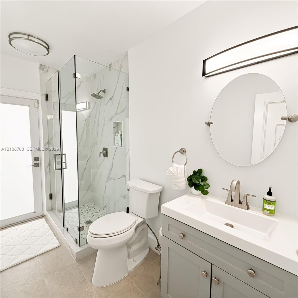 Bathroom with glass walk in shower