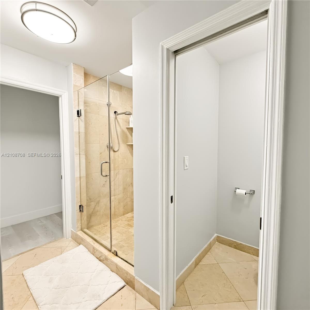 Primary bathroom with glass walk in shower