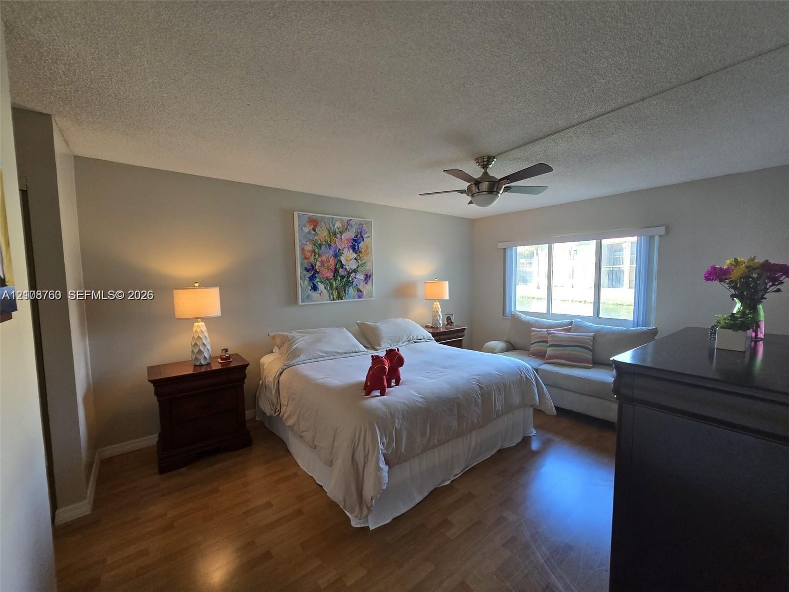Wood-finish flooring, multi-pane window, and integrated ceiling fan