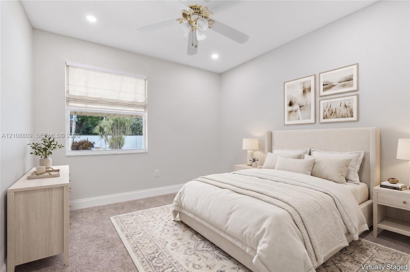 Neutral-toned room featuring plush wall-to-wall carpeting, recessed ceiling lighting, and a multi-blade ceiling fan with a central light fixture