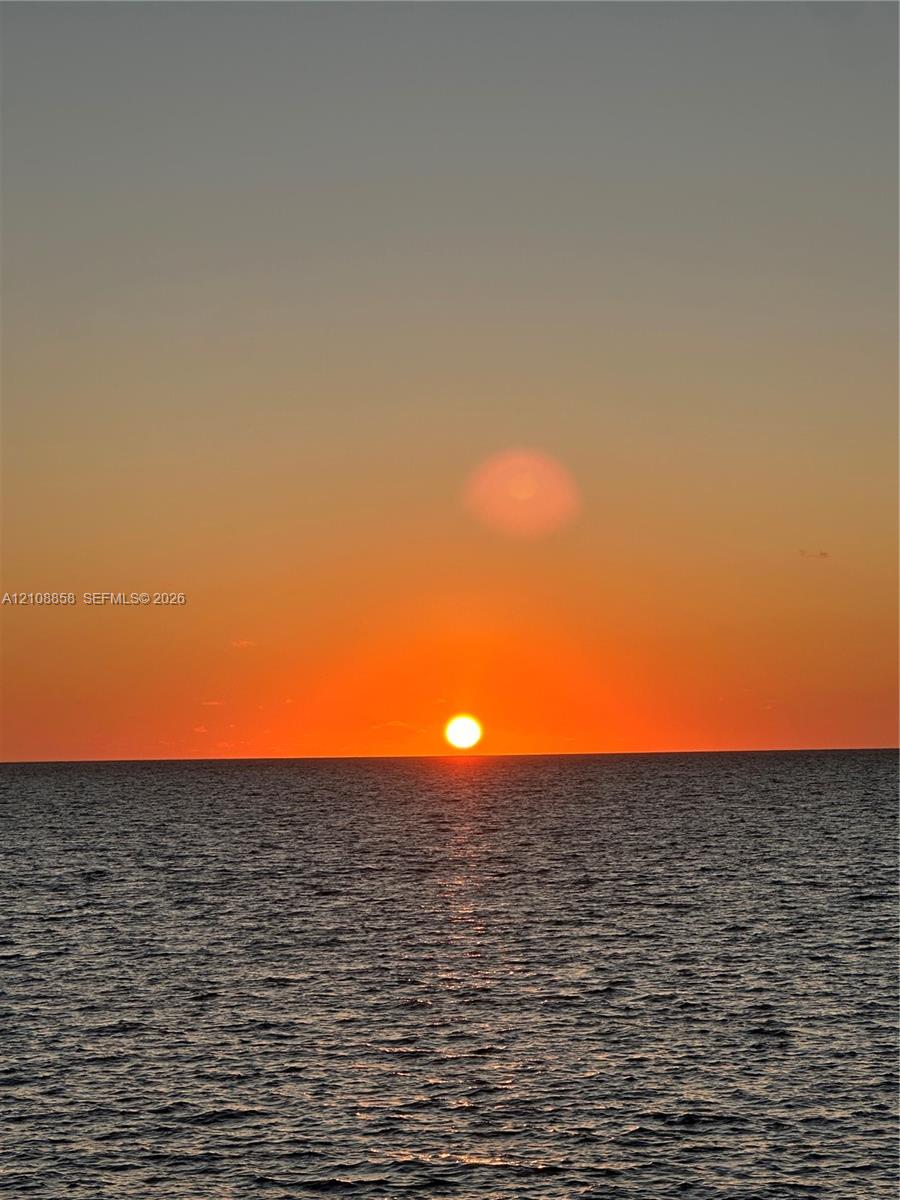 Ocean horizon featuring a prominent sunset backdrop Ocean horizon featuring a prominent sunset backdrop