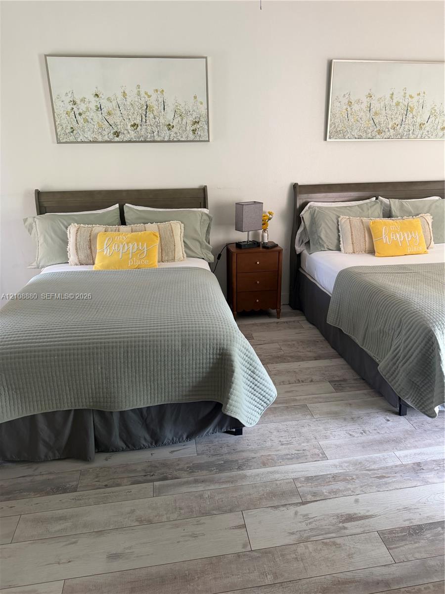 Neutral-toned wood-finish flooring throughout