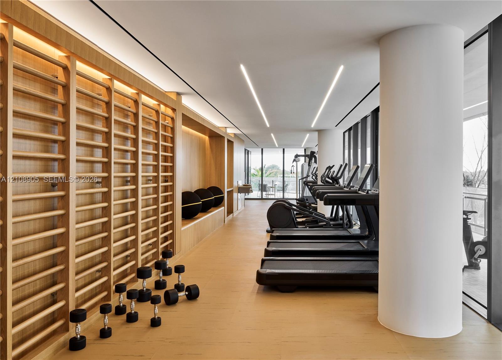 Custom light-wood built-in wall ladder system, integrated linear LED recessed lighting, expansive floor-to-ceiling windows, and wood-finish flooring