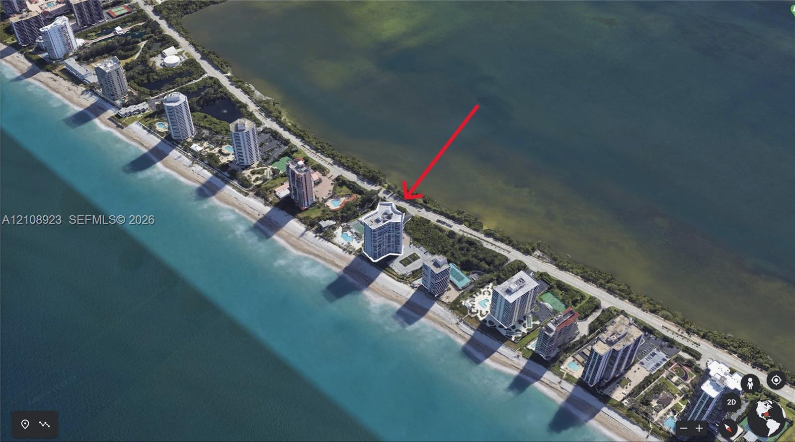Aerial perspective of coastal high-rise property featuring direct beachfront access, structured parking, and an outdoor swimming pool Aerial perspective of coastal high-rise property featuring direct beachfront access, structured parking, and an outdoor swimming pool