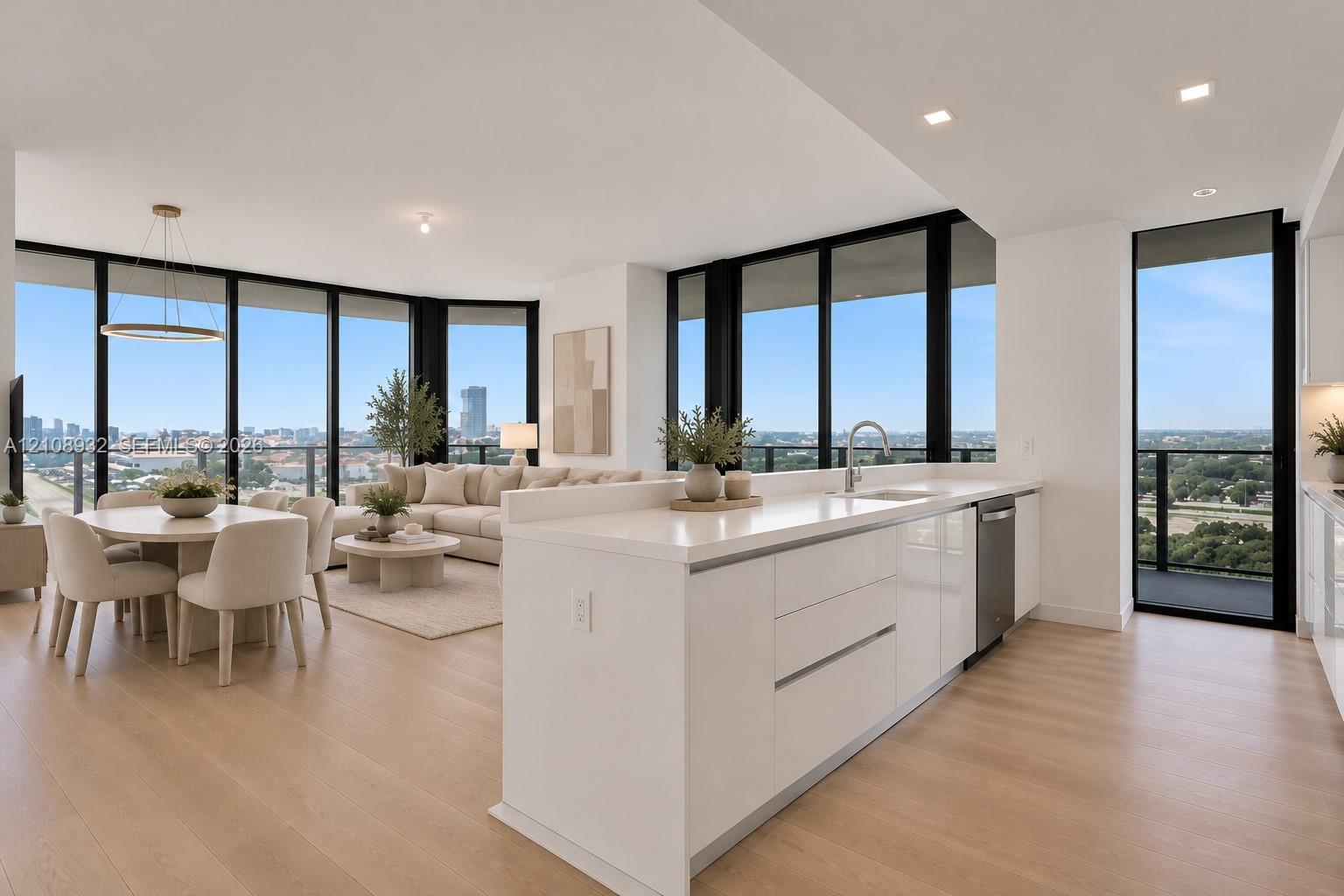 Open-concept living space featuring floor-to-ceiling windows, wood-finish flooring, recessed lighting, and a kitchen island with stone countertops and stainless steel appliances