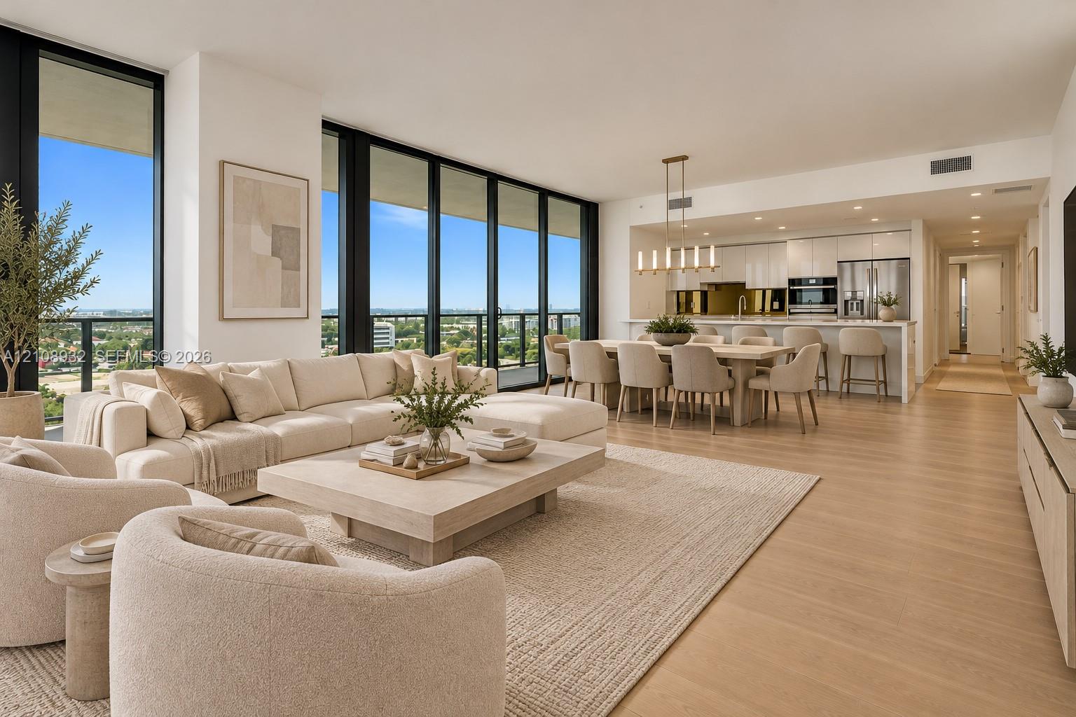 Open-concept living space featuring floor-to-ceiling windows, wood-finish flooring, recessed lighting, and a modern kitchen with built-in stainless steel appliances