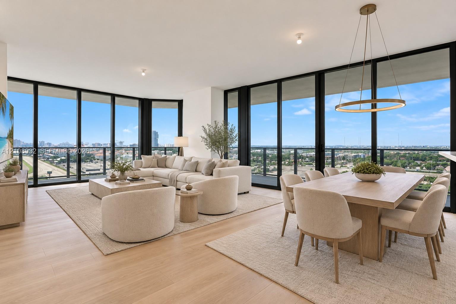 Floor-to-ceiling windows, wood-finish flooring, recessed lighting, and a circular metal-frame pendant light fixture Floor-to-ceiling windows, wood-finish flooring, recessed lighting, and a circular metal-frame pendant light fixture