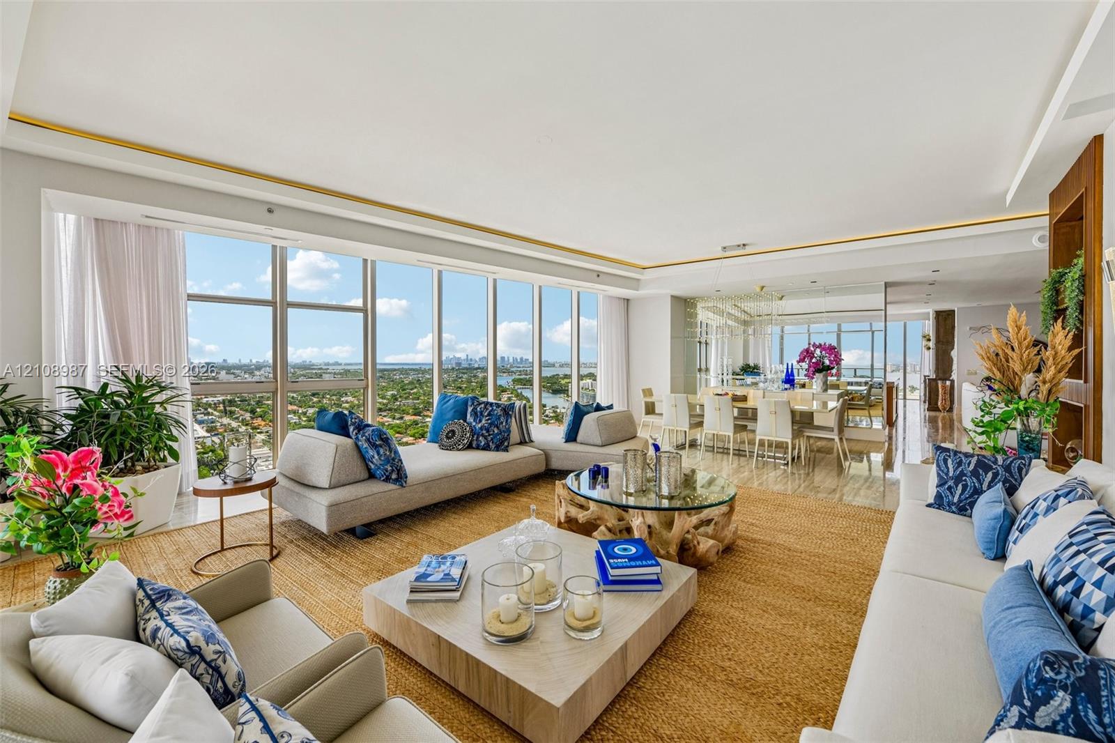 Floor-to-ceiling windows, high-gloss stone flooring, recessed perimeter ceiling detailing, built-in recessed wood shelving, and expansive open-plan layout Floor-to-ceiling windows, high-gloss stone flooring, recessed perimeter ceiling detailing, built-in recessed wood shelving, and expansive open-plan layout
