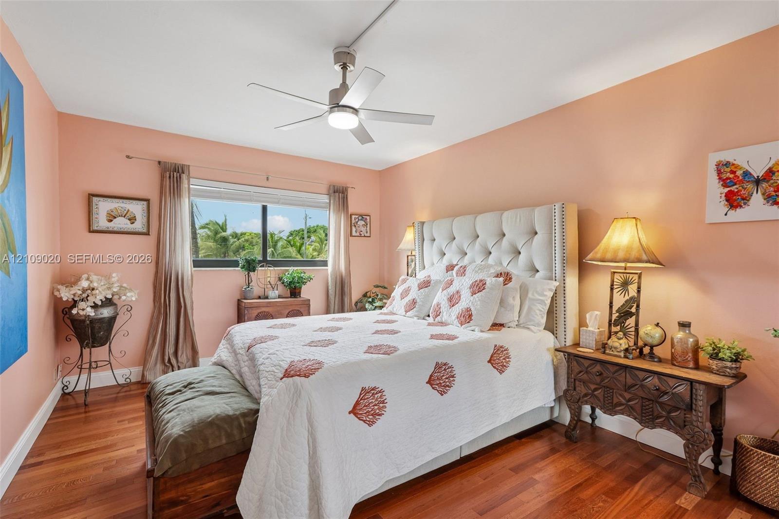Wood-finish flooring, ceiling fan with integrated lighting, and horizontal sliding window