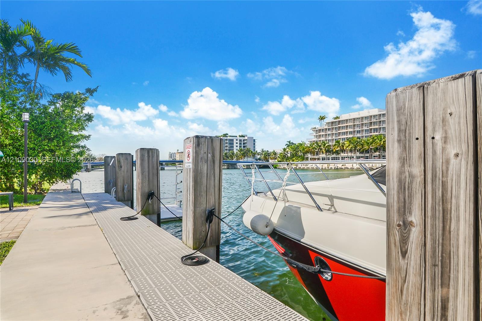 Deep-water dock featuring wooden pilings, concrete and composite decking, and secure boat mooring hardware