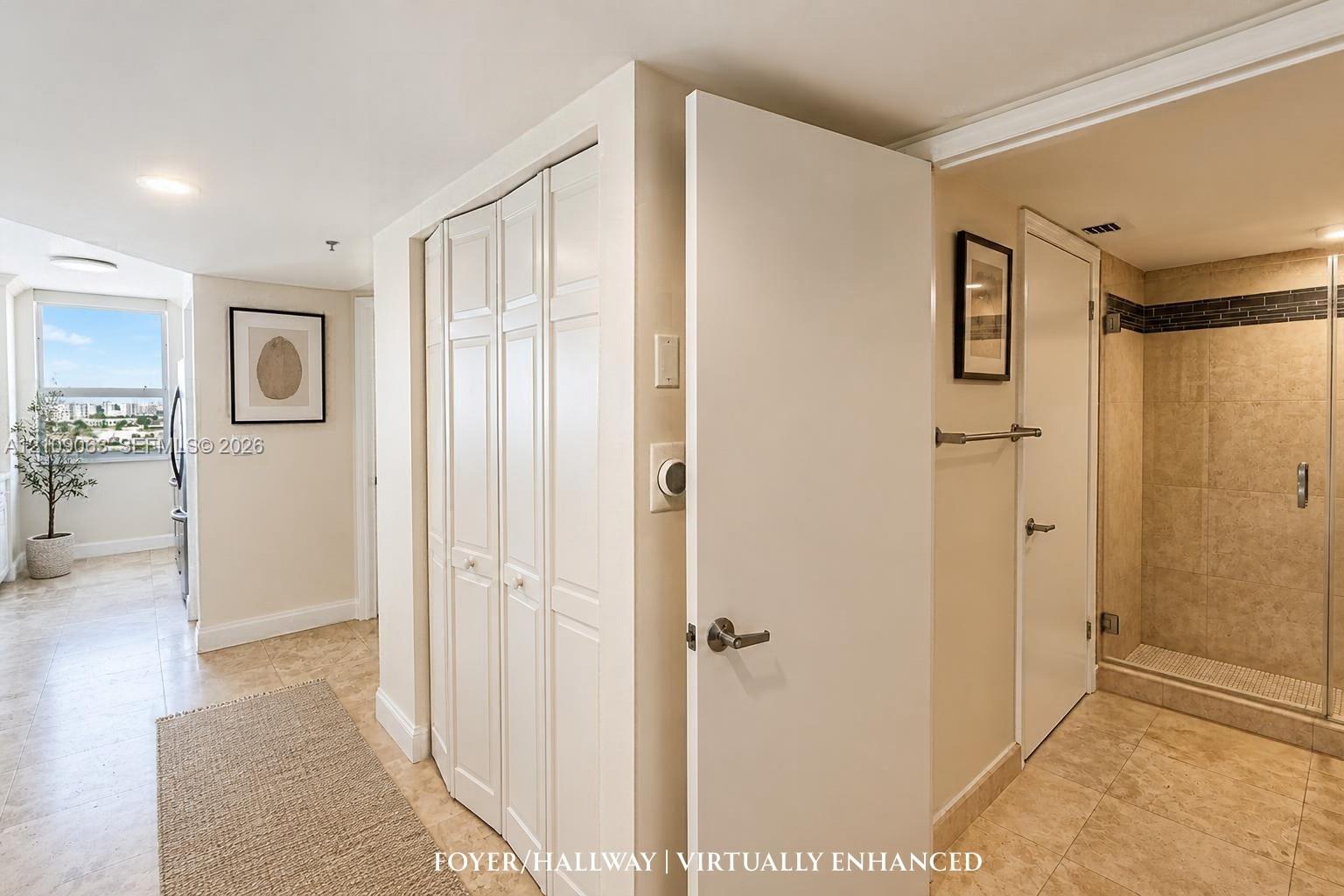 Neutral tile flooring, multi-panel bi-fold closet doors, and walk-in shower with stone-finish tile surround and recessed lighting