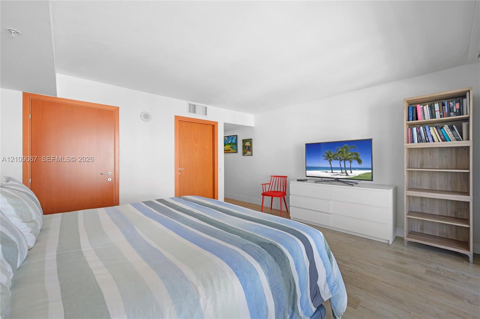 Neutral wall palette featuring wood-finish flooring and solid core wood doors Neutral wall palette featuring wood-finish flooring and solid core wood doors