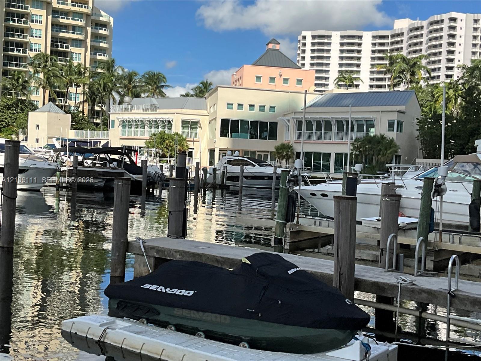 Waterfront property featuring a private deep-water dock, multiple boat slips, and piling supports