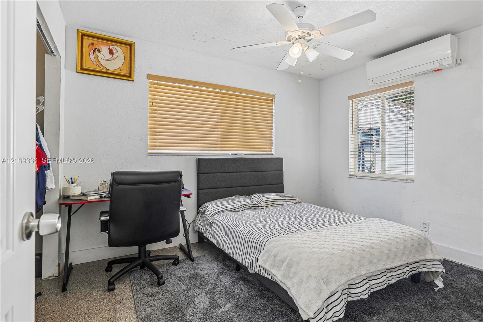 Wall-mounted mini-split climate control system, ceiling fan with integrated lighting, and horizontal window blinds