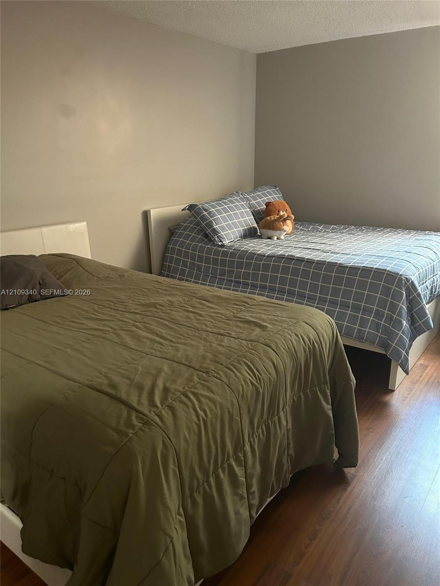Room featuring neutral-toned walls and wood-finish flooring