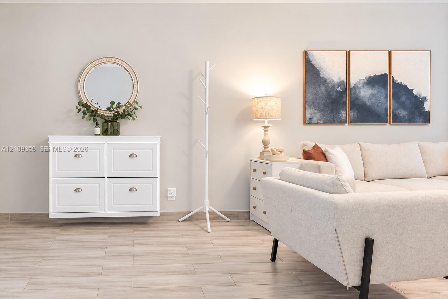 Wood-finish flooring and wall-mounted white cabinetry Wood-finish flooring and wall-mounted white cabinetry
