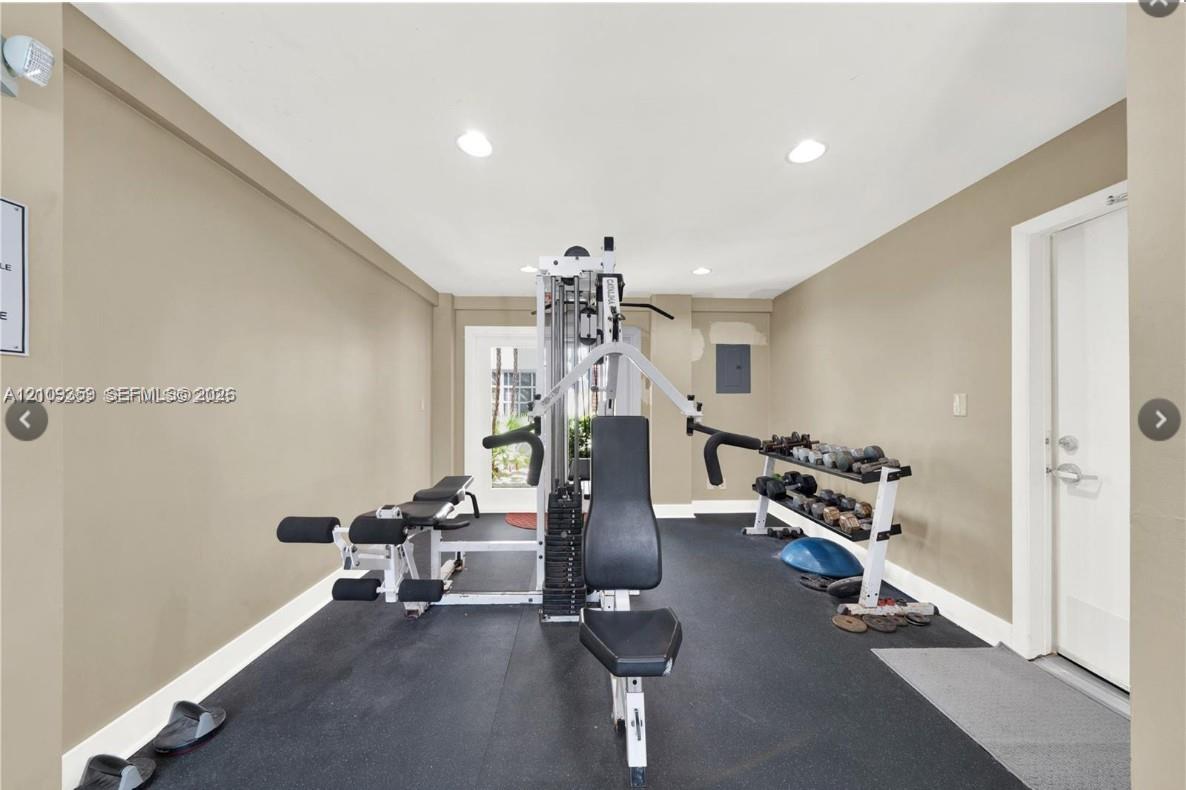 Fitness room featuring recessed lighting and impact-resistant rubber flooring