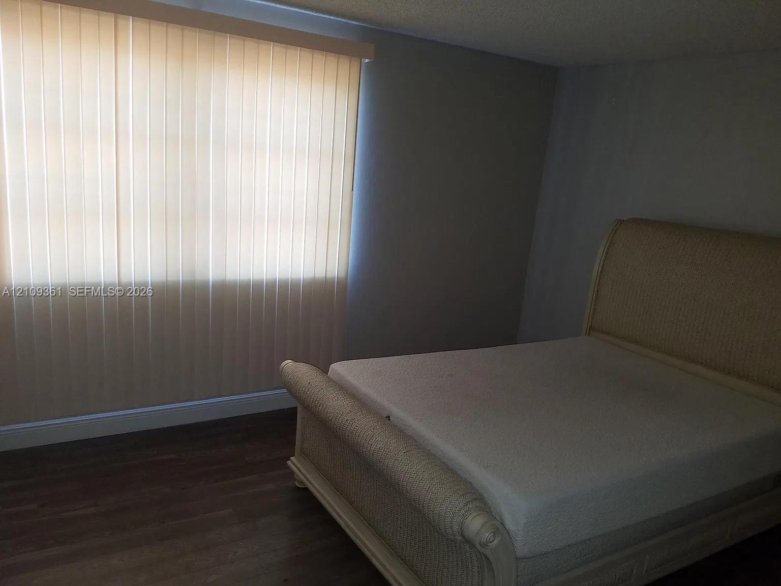 Wood-finish flooring and vertical window blinds