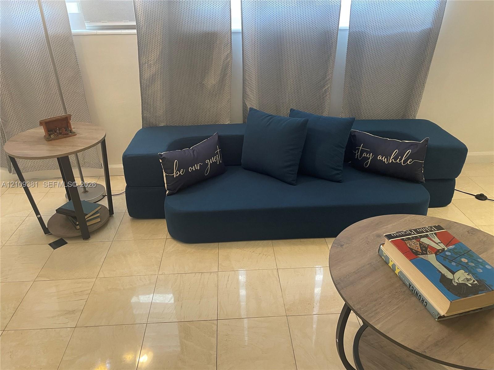 Large-format tile flooring and neutral wall finish