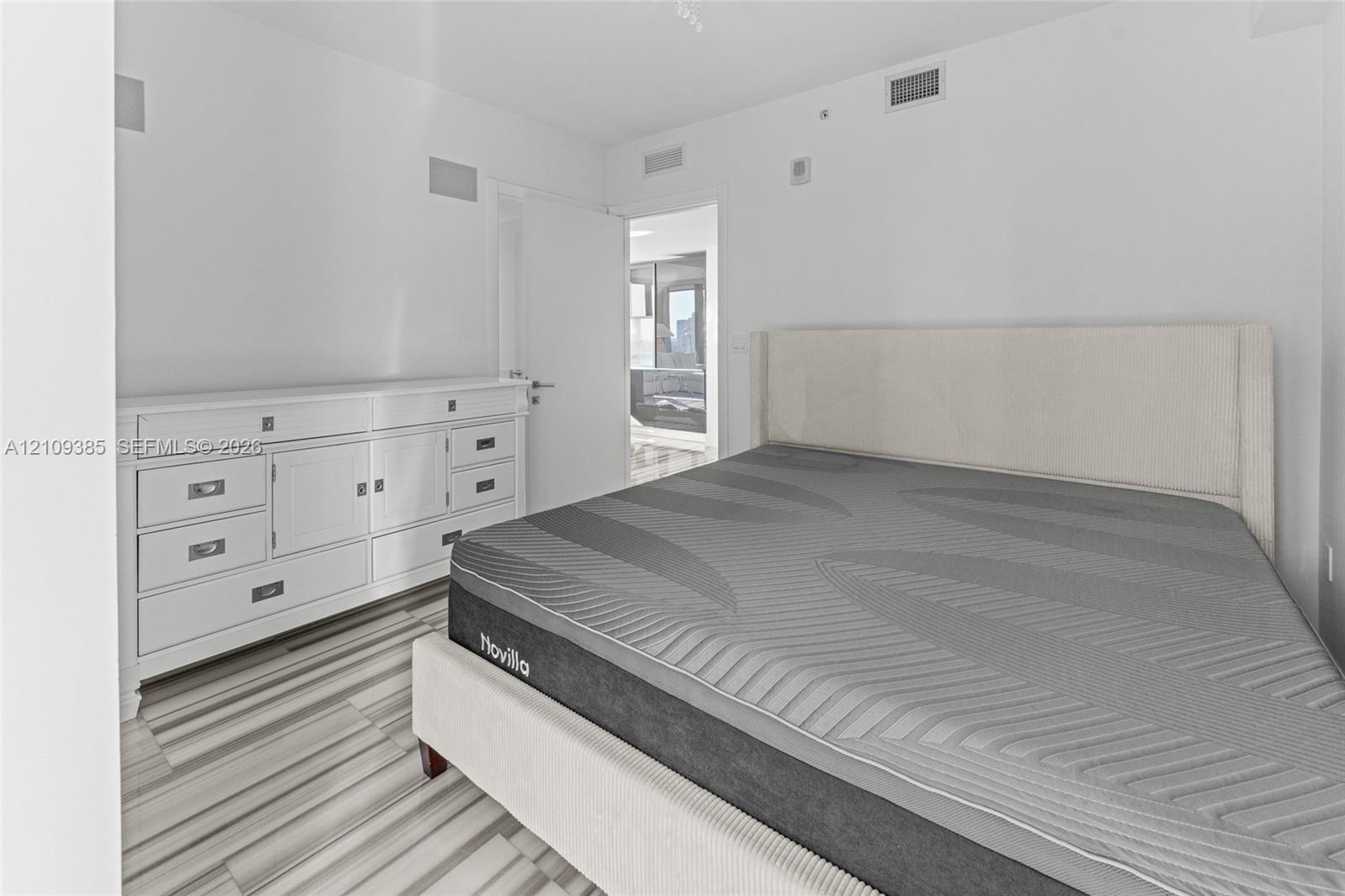 Interior space featuring wood-finish flooring and neutral wall finishes