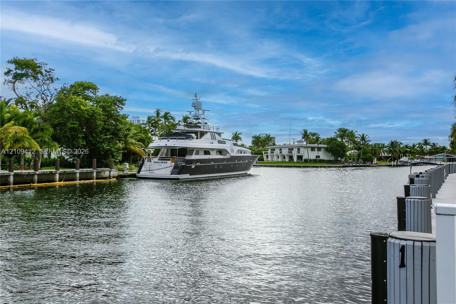 Waterfront bulkhead featuring concrete pilings and deep-water access with canal frontage