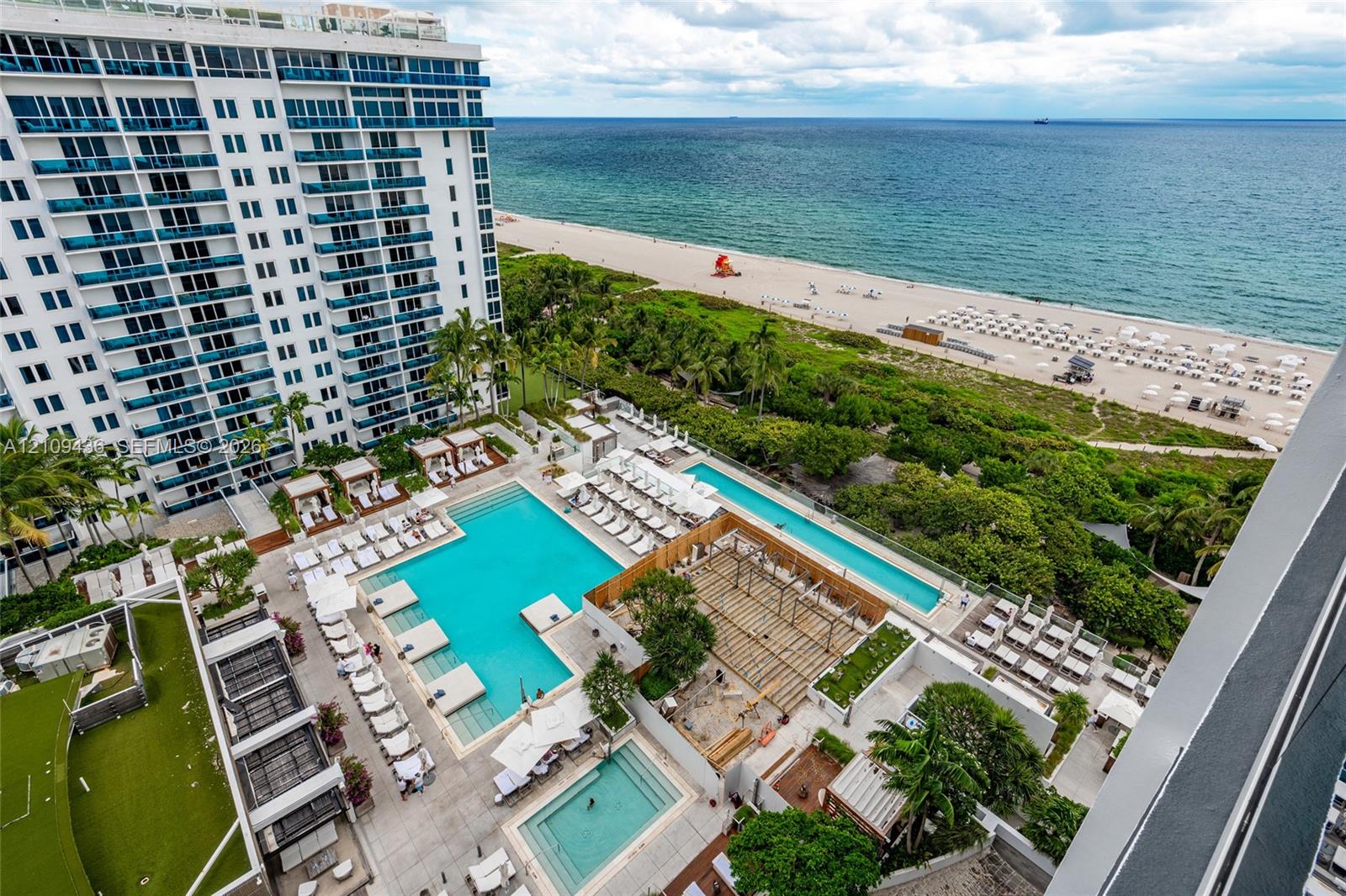 High-rise oceanfront property featuring multiple tiered swimming pools, extensive paved sun deck, structured pergola, and landscaped grounds High-rise oceanfront property featuring multiple tiered swimming pools, extensive paved sun deck, structured pergola, and landscaped grounds
