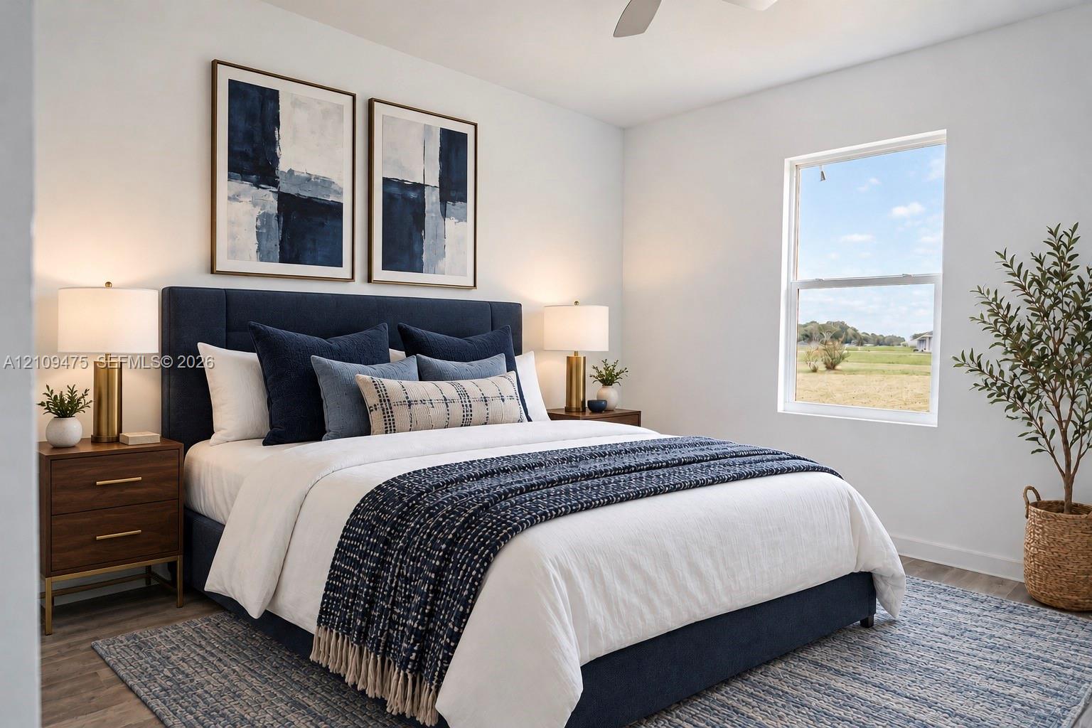 Neutral interior finishes including wood-finish flooring, crisp white walls, and a single-hung window with exterior landscape exposure