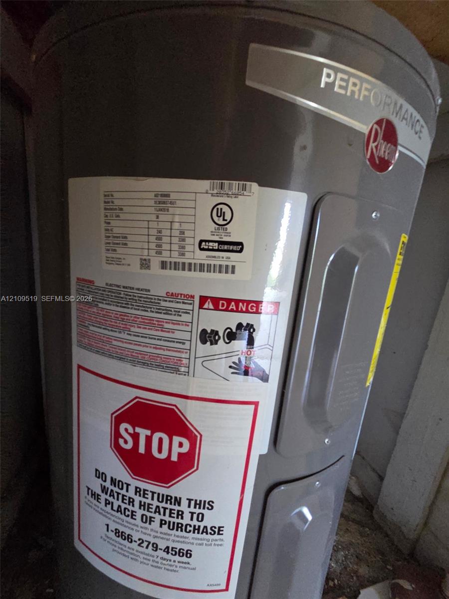 Electric water heater inside laundry closet area inside unit
