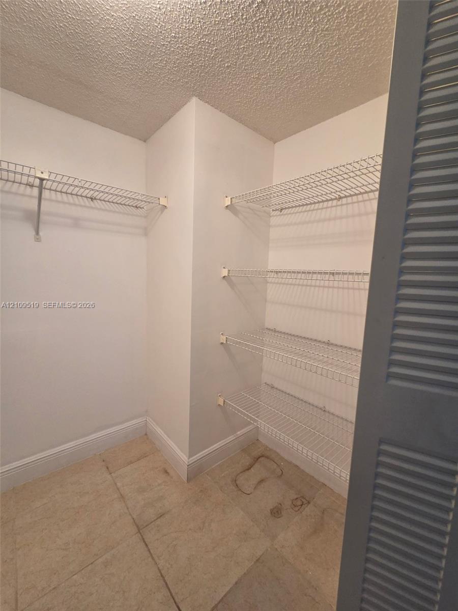 Walk-in closet in Primary bedroom suite is generously sized offering lots of storage.