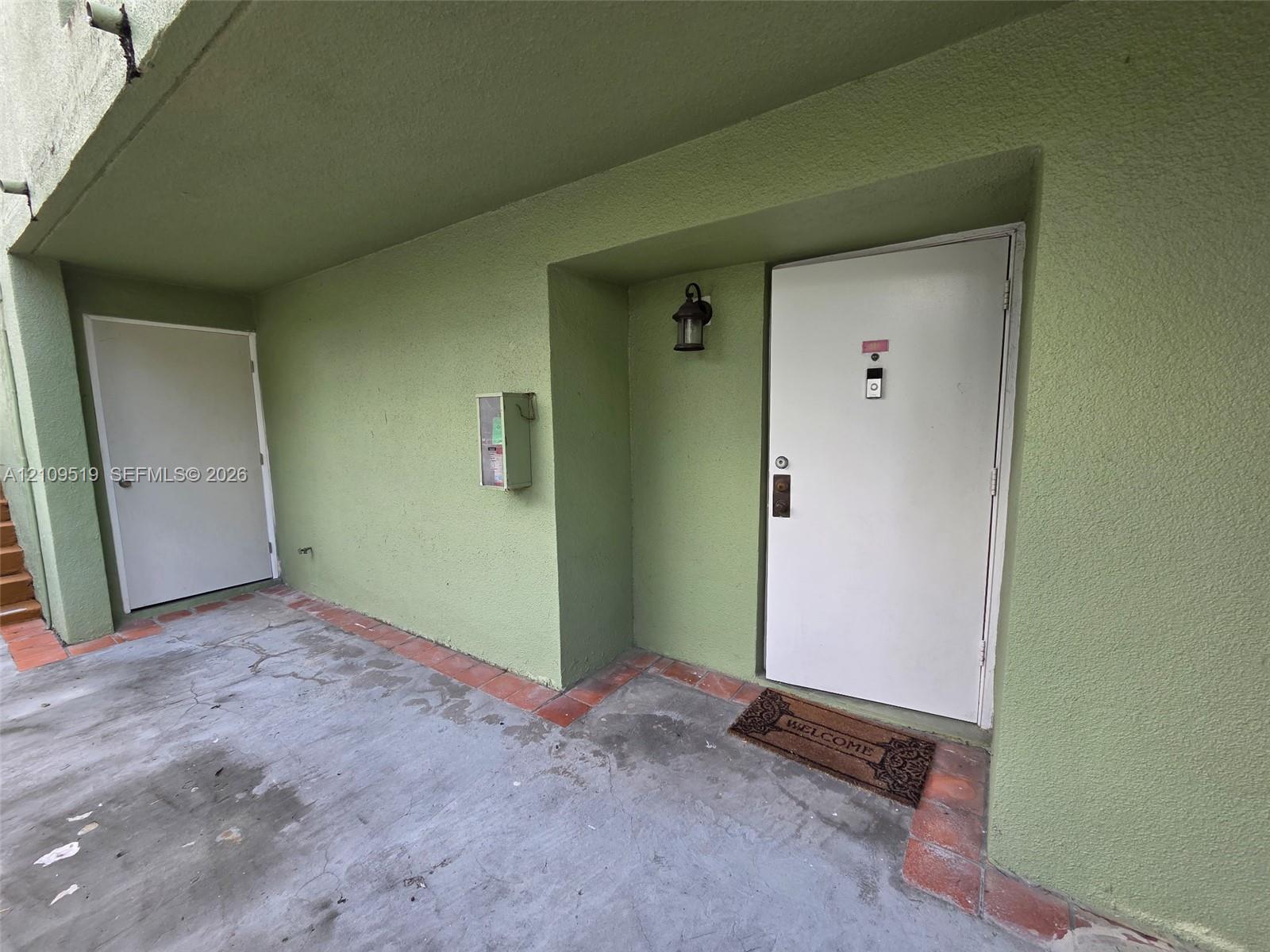 Covered entrance to unit. Ground-level corner unit encompasses entire first floor of structure. Features deeded parking in front of your unit plus guest parking spaces. Convenient easy access thru both private terraces into primary bedroom and living room.