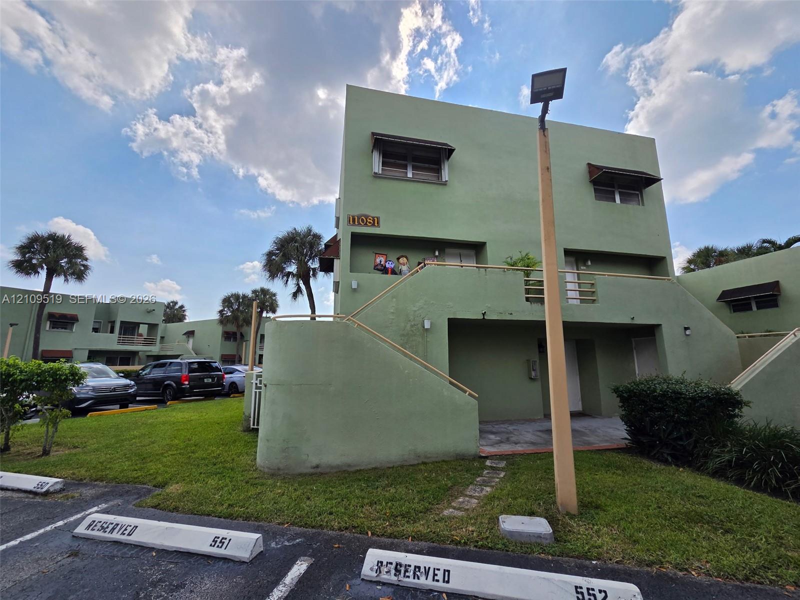 Ground-level corner unit encompasses entire first floor of structure. Features deeded parking in front of your unit plus guest parking spaces. Convenient easy access thru both private terraces into primary bedroom and living room.