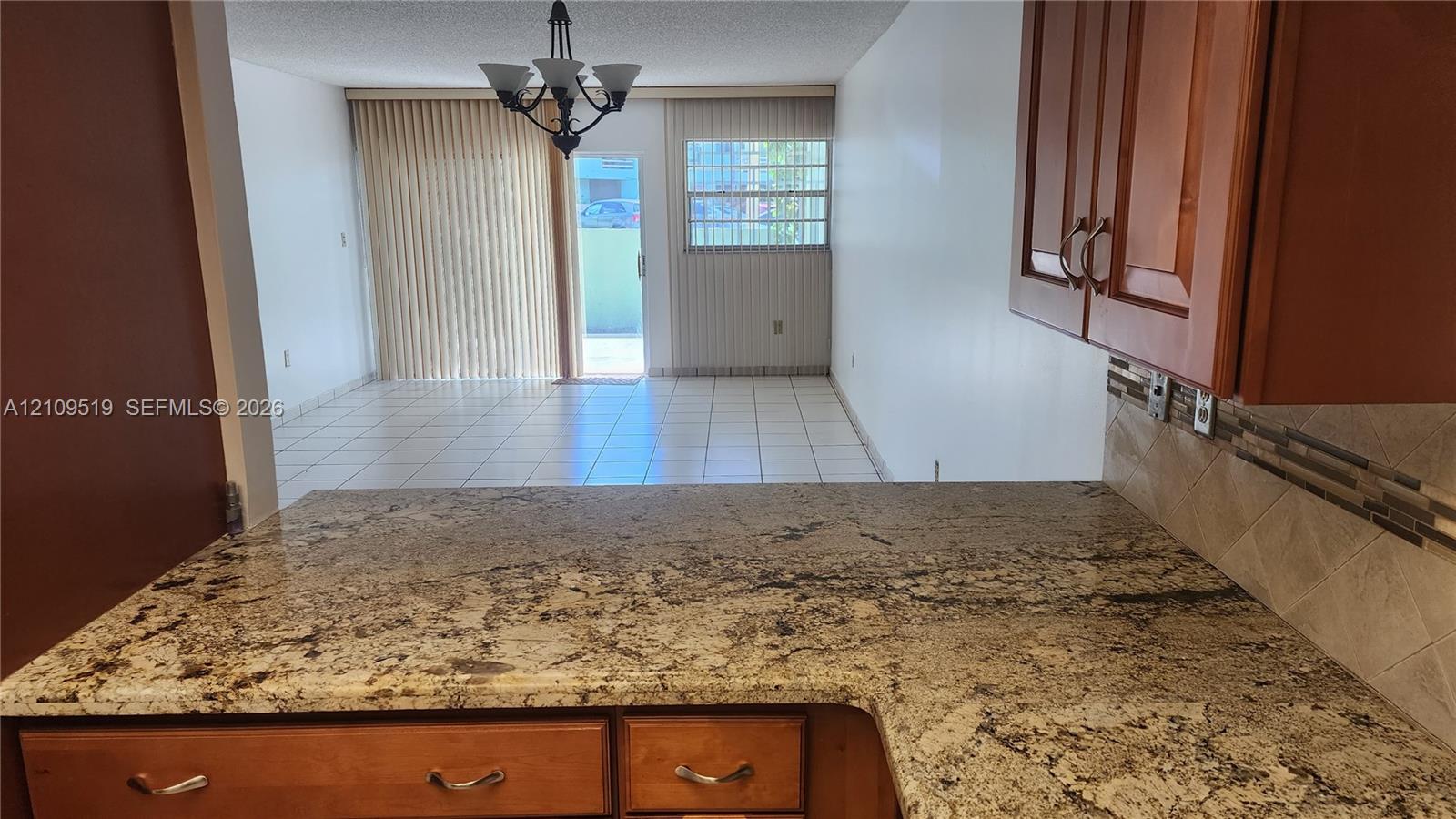 Easy access pass-thru granite counter/Breakfast counter.