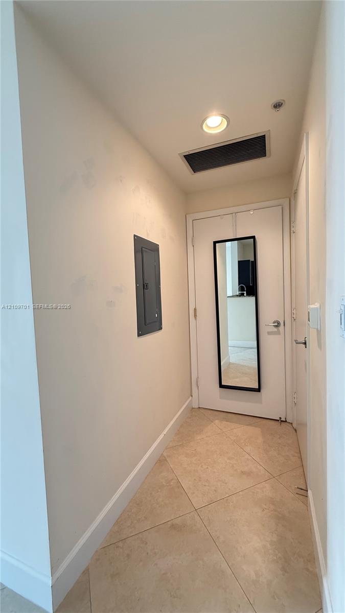 Diagonal-set stone flooring and recessed ceiling lighting Diagonal-set stone flooring and recessed ceiling lighting