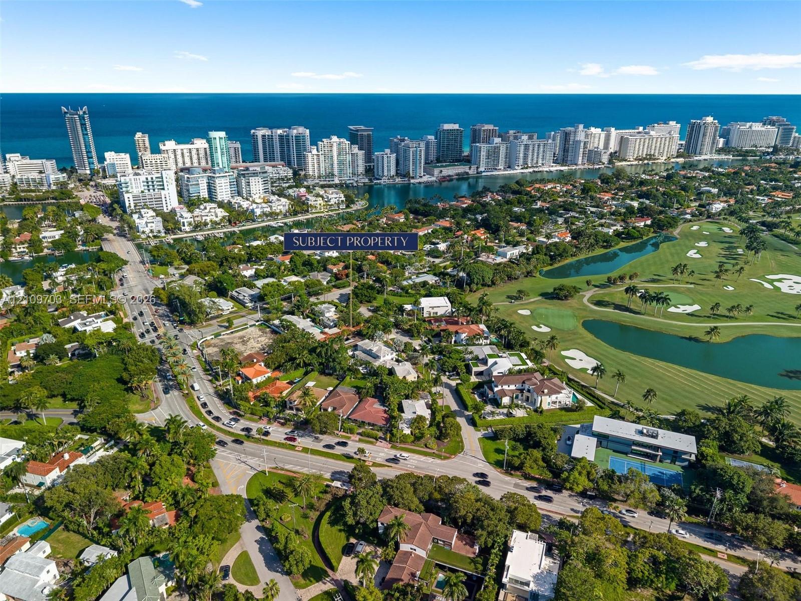 Aerial perspective featuring proximity to coastal waterways, local golf course fairways, and mature tree-lined surroundings