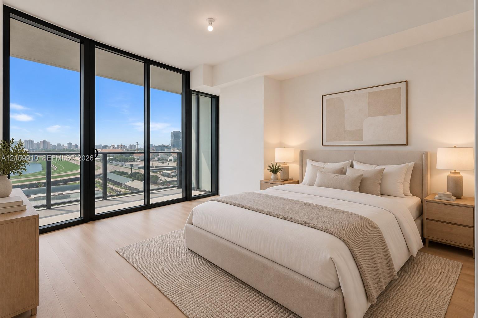 Floor-to-ceiling glass sliding doors, private balcony, wood-finish flooring, and neutral wall tones