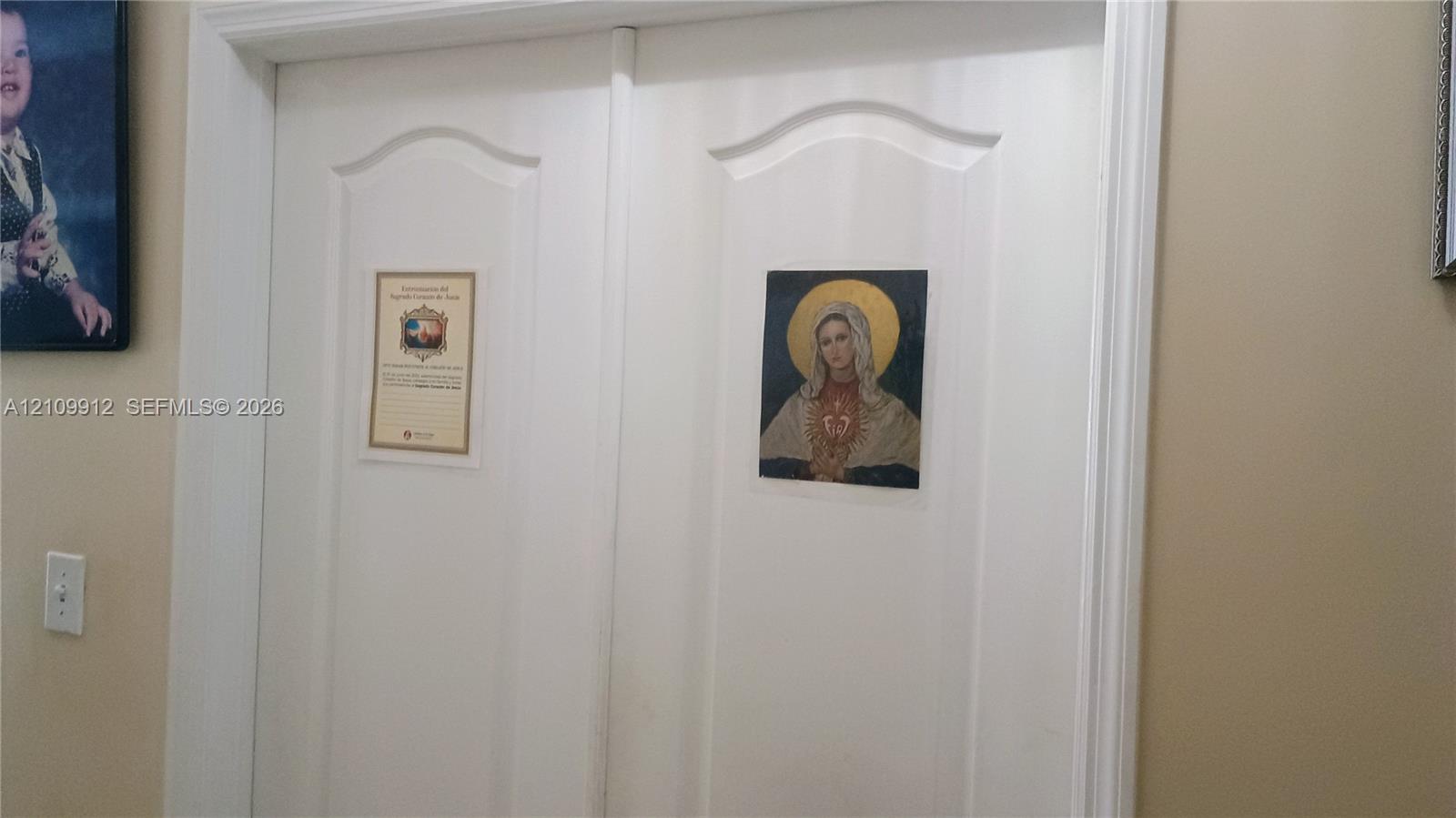 Double-door entry featuring a raised-panel design and decorative casing